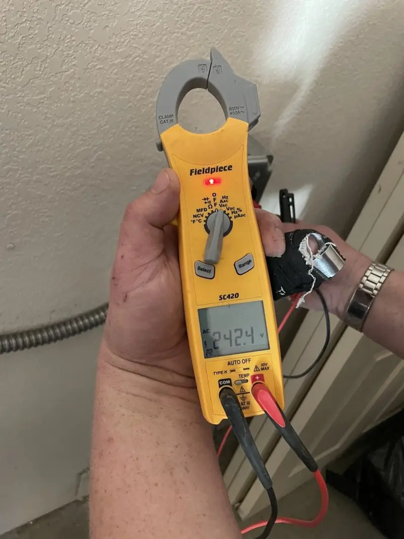Voltage testing with clamp meter during Recessed Lighting Installation in Richfield